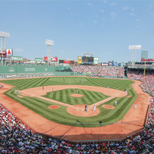 A crowd enjoys a baseball game at Fenway Park in Boston, Massachusetts